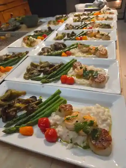 Plated scallop and shrimp risotto dinners for a private event in Asheville NC